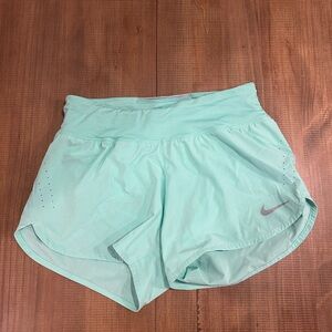 Nike Dri fit women’s running shorts with pocket teal